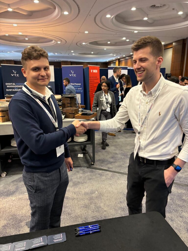 Joe Moore shaking hands with a new contact at the Commodities Trading Week Conference.