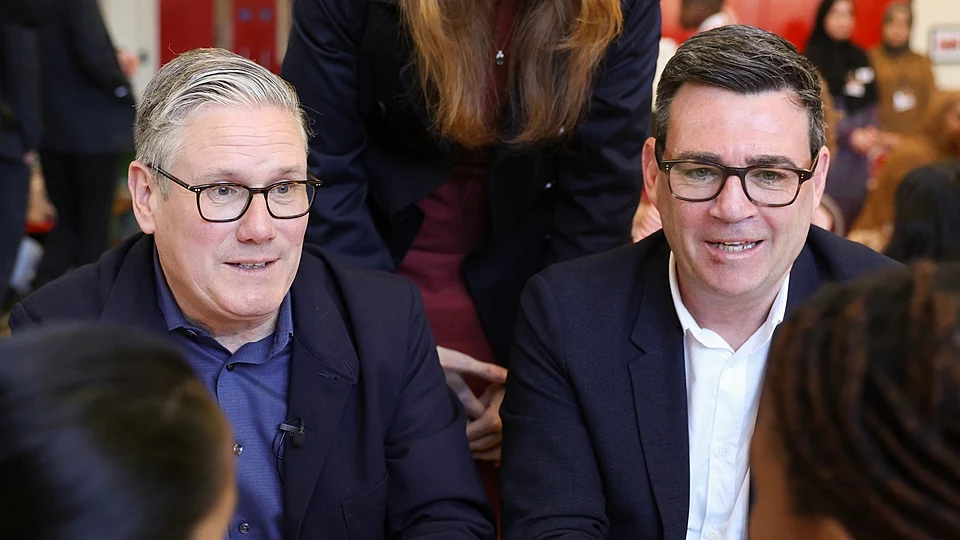 Keir Starmer and Andy Burnham sat together during a press event.